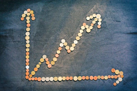 An upward trend graph made from coins representing financial growth and success.
